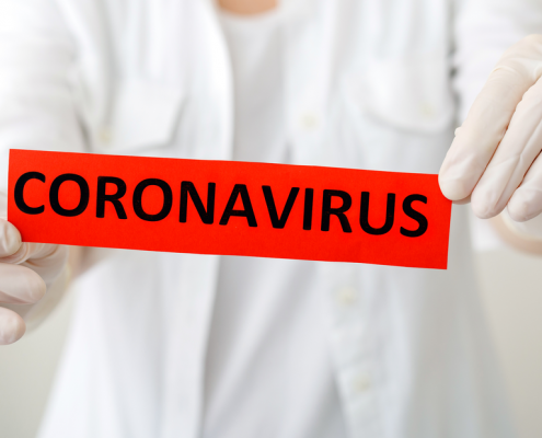 Health care worker holding coronavirus sign