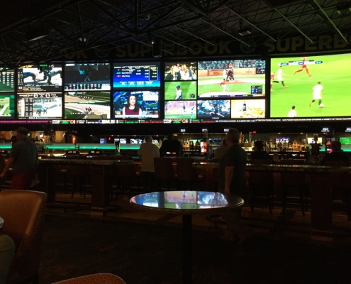 Bar with multiple TV screens showing various sports games